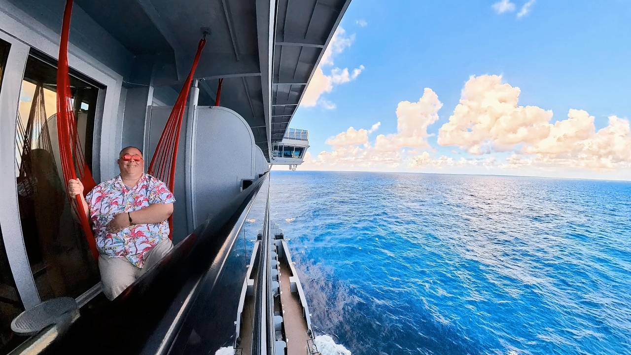 James in a hammock chair on Virgin Voyages Brilliant Lady