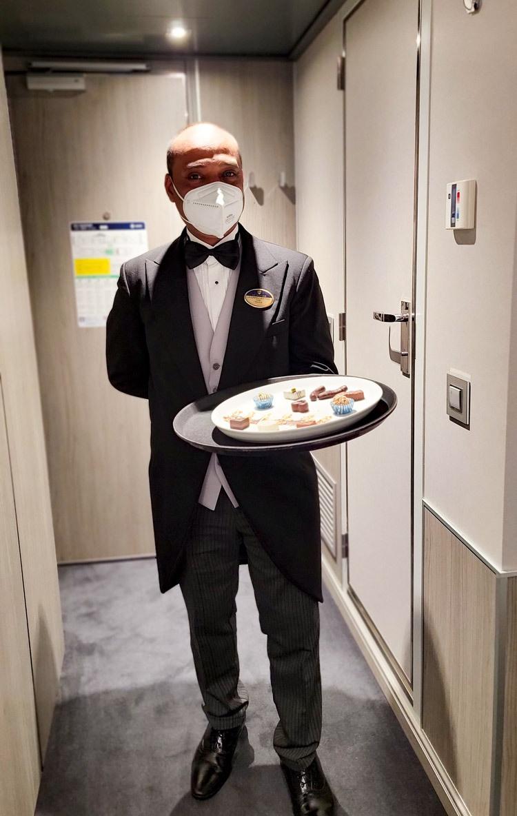 msc cruise butler delivery canapes in msc yacht club suite