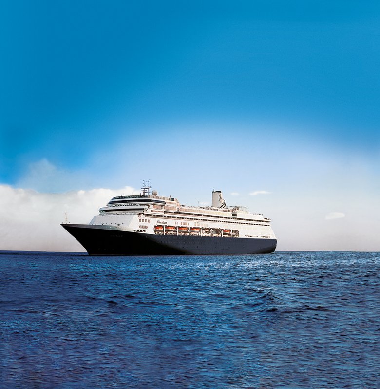 Holland America Line's Volendam sailing on open water under a blue sky
