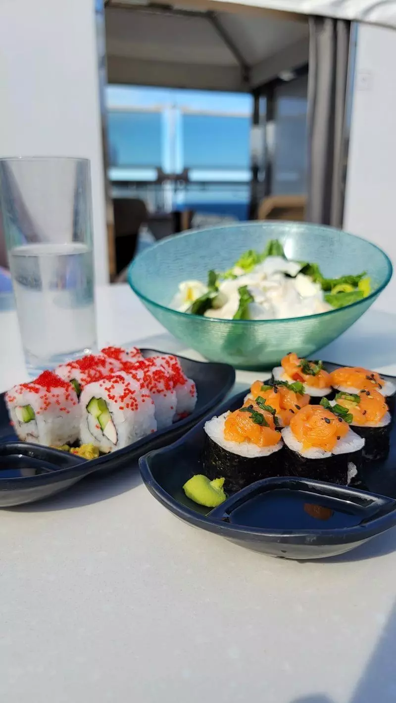sushi and salad for lunch in the retreat cabana area on holland america line koningsdam