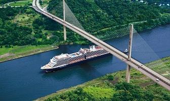Holland America Line Nieuw Amsterdam passing under Puente Centenario bridge on Panama Canal